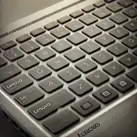 A high-resolution, close-up image of a Lenovo laptop keyboard.