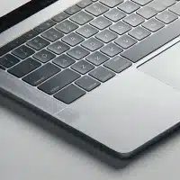 MacBook keyboard on a white background. The image focus on the keyboard needing replacement
