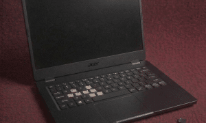 A high-quality replacement QWERTY keyboard for an Acer laptop featuring a dedicated numeric keypad and internal flex cable, shown on a solid light pink background for Atlantis repair services.