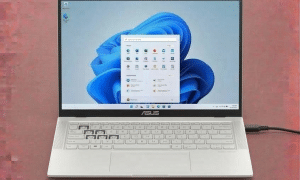 A premium replacement UK-layout QWERTY keyboard for an Asus ZenBook, featuring original tactile response and backlit support, displayed on a solid light pink background for Atlantis repair services.