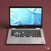 A premium replacement backlit QWERTY keyboard assembly for a Dell laptop, shown on a solid light pink background for Atlantis repair services.