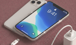 A professional technician installing a premium replacement Super Retina XDR OLED screen for the iPhone 11 Pro, shown on a solid light pink background for Atlantis repair services.