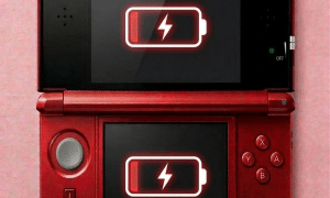 A premium high-capacity replacement lithium-ion battery for a Nintendo 3DS XL, shown on a solid light pink background for Atlantis UK-wide console repair services.