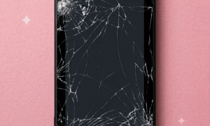 A premium replacement 6.2-inch LCD panel and touch digitiser for a Nintendo Switch, displayed on a solid light pink background for Atlantis UK-wide console repair services.