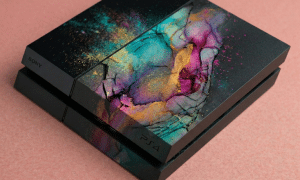 Close-up of an internal PlayStation 4 power supply unit (PSU) and power connector, positioned on a solid light pink background for Atlantis repair services.