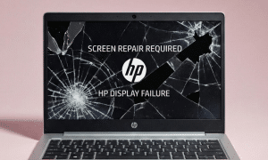 Professional studio photograph of a silver HP laptop with a severely cracked screen displaying "SCREEN REPAIR REQUIRED" and "HP DISPLAY FAILURE" text, set against a light pink background, representing UK screen repair services.