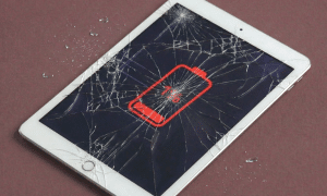 A premium replacement 10.2-inch tempered glass digitiser and touchscreen assembly for an iPad, shown on a solid light pink background for Atlantis repair services.