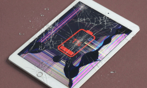 A premium replacement Retina LCD internal display panel for an iPad, shown on a solid light pink background for Atlantis repair services.