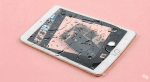 A high-quality replacement 8MP rear-facing camera module for an iPad 6th, 7th, 8th, or 9th generation, shown on a solid light pink background for Atlantis repair services.