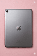 A premium replacement aluminium rear housing for an iPad Mini, shown on a solid light pink background for Atlantis iPad Mini back repair services.