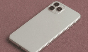 A high-quality replacement rear housing chassis with an integrated glass back panel and aerospace-grade aluminum frame for the iPhone 11 series, shown on a solid light pink background for Atlantis repair services.