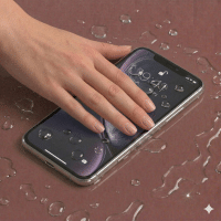 Detailed internal view of an iPhone 11 logic board showing specialist corrosion removal and ultrasonic cleaning, positioned on a solid light pink background for Atlantis repair services.