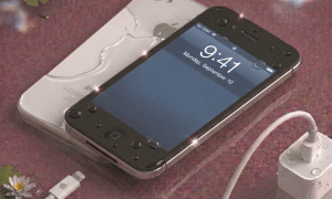 Detailed internal view of an iPhone 4S logic board undergoing specialist corrosion removal and chemical cleaning, positioned on a solid light pink background for Atlantis repair services.