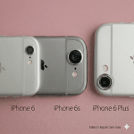 Close-up of the rear camera lens and flash on an Apple iPhone 6 and 6S series handset, set against a solid light pink background for Atlantis repair services.