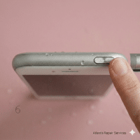 Close-up of the power and volume buttons on the side profile of an Apple iPhone 6 and 6S series handset, set against a solid light pink background for Atlantis repair services.