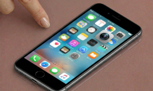 Close-up of a high-resolution replacement rear camera module with optical image stabilisation for the iPhone 7, 8, and SE series, positioned on a solid light pink background for Atlantis repair services.