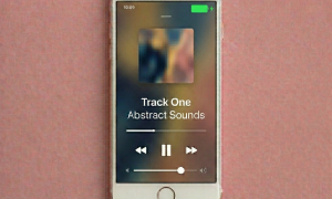 Close-up of a high-capacity internal replacement battery for the Apple iPhone 7, 8, and SE series, positioned on a solid light pink background for Atlantis repair services.