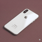 A high-quality replacement rear housing chassis with a glass back panel and integrated frame for the iPhone X, XR, and XS series, shown on a solid light pink background for Atlantis repair services.