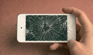 Close-up of a high-quality replacement Retina display assembly and digitiser for the Apple iPod Touch 3, 4, 5, 6, and 7 series, positioned on a solid light pink background for Atlantis repair services.