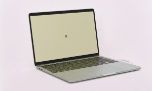 High-quality MacBook Air with a flawlessly restored screen on a clean white background, showcasing affordable Atlantis repair services.