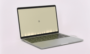 MacBook Pro display showing the Flexgate stage light effect at the bottom of the screen, professionally repaired by Atlantis with a 1-year warranty