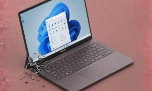 A replacement heavy-duty steel hinge and reinforced lid mounting bracket for an Asus ZenBook, displayed on a solid light pink background for Atlantis UK-wide repair services.